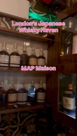 Guests enjoying premium Japanese whiskies and tapas at MAP Maison, a chic bar in East London.