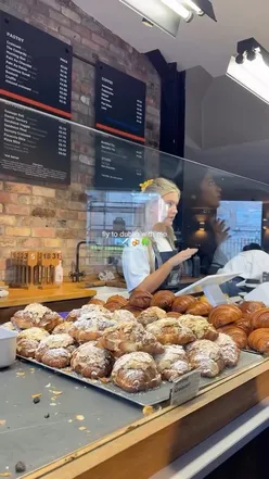 Couple planning a weekend trip to Dublin with drinks and a plane ticket, capturing travel excitement.