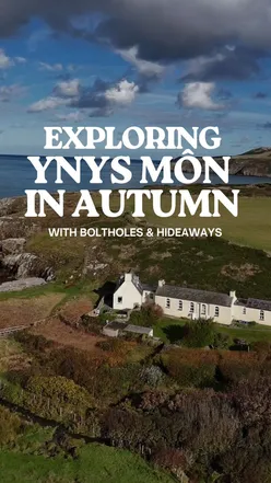 Cozy dog-friendly cottage with beach access, hot tub, and stunning views in Church Bay, Anglesey, perfect for autumn getaways.