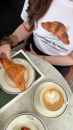 Limited edition Uniqlo t-shirt featuring a French croissant, celebrating the PAUL Bakery and Uniqlo collaboration.