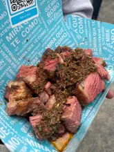 Delicious smoked meats at FUME BBQ Fest 2025, featuring ribs, burgers, and more in a meat lover's paradise.