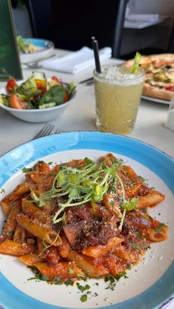 Family enjoying authentic Italian dishes at Da-Zero restaurant in Chester-le-Street, highlighting pizza and fresh pasta.