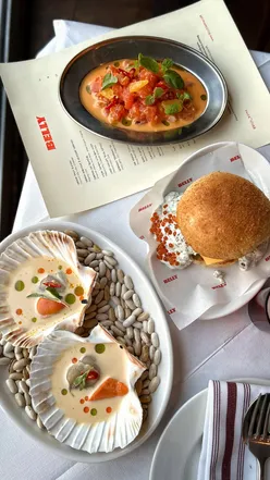 Delicious Filipino dishes at Belly Bistro in Kentish Town, featuring wagyu steak and coconut milk scallops.