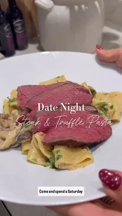 Delicious steak and truffle pasta, perfect for a romantic date night meal shared with a loved one.
