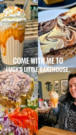 Cozy interior of Lucy's Little Bakehouse showcasing delicious cakes and a warm atmosphere perfect for autumn.