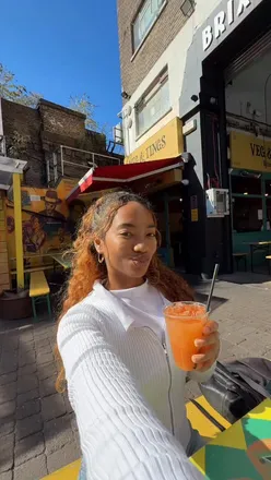 Delicious Caribbean vegan dishes at Veg & Tings in Brixton Village, London, with a warm and inviting atmosphere.