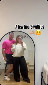 Vloggers enjoying food and drinks in vibrant Aberdeen, capturing fun moments together.
