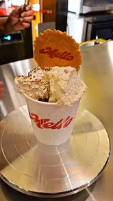 Indulgent hazelnut hot chocolate topped with torched marshmallow and whipped cream at Seven Dials Market, London.