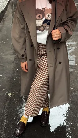 Cozy morning scene featuring gifted fashion, coffee machine, and vitamins, styled in pyjamas and bathrobe.