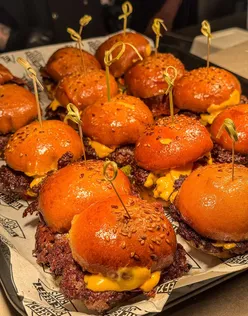 Delicious burgers and crispy chicken tenders at The Beefy Boys Oxford launch night, highlighting their mouthwatering menu.