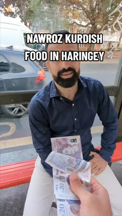 Enjoying Nawroz Kurdish cuisine with a new friend at Nawroz Restaurant, showcasing vibrant flavors and culture.