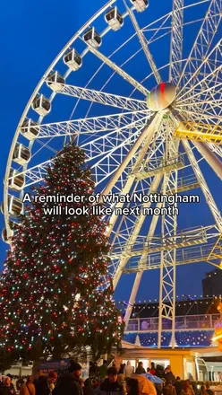 Excited visitors at Nottingham Winter Wonderland, eagerly anticipating coconut macaroons and festive treats.