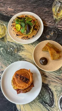 Enjoying a bottomless brunch at Roe Restaurant with delicious dishes, drinks, and desserts for £59pp in London.