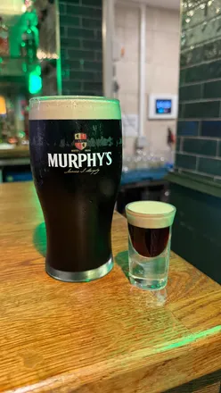 Revamped Katie O’Brien’s in Birmingham brims with Guinness, live music, and Irish decor in a vibrant atmosphere.