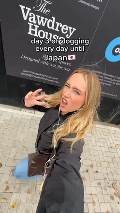 Traveler celebrating 226 miles completed, aiming for Switzerland, with enthusiasm and hope.