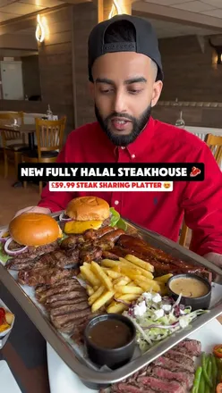 Delicious spread at Crazy Cow Steakhouse in Barking, featuring rib eye steak, chicken burger, and steak platter for sharing.