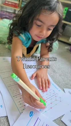 Child enjoying worksheets from Twinkl Parents, highlighting fun and productive learning at home.