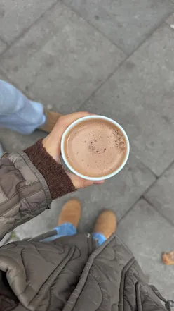 Enjoying a cozy hot chocolate at itsmegansofhighgate in autumnal London, my favorite neighborhood.