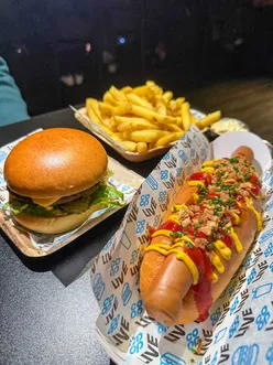 Enjoying gourmet food and drinks in the OVO Lounge at a OneRepublic concert in Manchester.