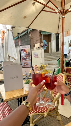 Person planning 2026 holiday trips with bright butterfly and sun emojis, referencing Compare The Market for savings.