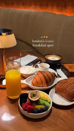 Indulgent breakfast spread at Cedric Grolet in London, featuring pastries, fruit, and waffles for a luxurious start to the day.