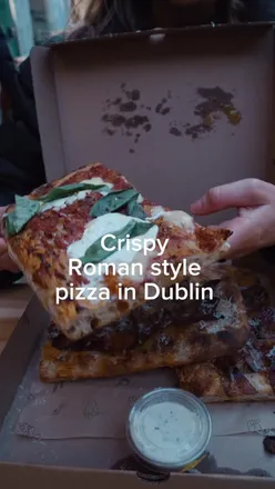 Delicious Roman-style pizza slices at Mani Pizza on Drury Street in Dublin City, including their famous carbonara slice.