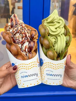 Enjoying crispy egg puffs at Mammy Pancake in Notting Hill, London - a taste of Hong Kong's favorite street snack.