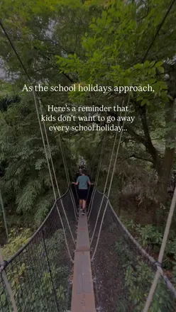 Step mom enjoying cozy day at home with older kids in PJs, making memories during school holiday.