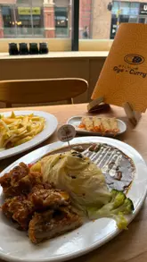 Delicious Japanese curry and ebi fry served at Gyocurry in Birmingham, featuring a cozy anime-themed ambiance.
