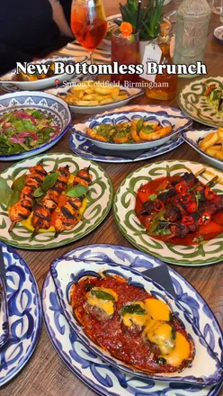 Group enjoying Mediterranean bottomless brunch with drinks and dishes at Willow Restaurants, Sutton Coldfield.