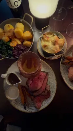 Delicious roast dinner served at Pearly Cow, Brighton, featuring stunning flavors and seaside ambiance.