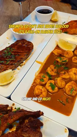 Delicious seafood and grilled dishes at Shrimp & Co, Star City, featuring crispy shrimp, salmon, steak, and refreshing drinks.