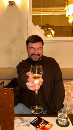 Enjoying chicken and champagne at Cuvée in Glasgow, with a vibrant atmosphere and tarot readings.