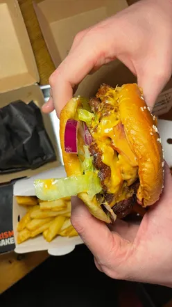 Burgerism in Manchester offers smashed patties, stacked toppings, and delicious fries at Freight Island.