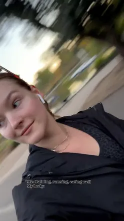 Lifestyle blogger sharing a playful moment reflecting on fitness struggles, with a humorous expression.