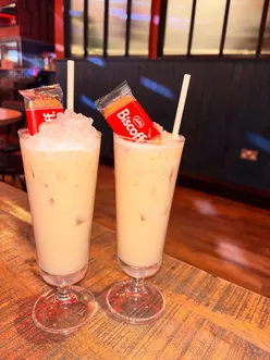 Enjoying vibrant cocktails and pizza at TWENTY TWENTY in Newcastle, showcasing their new bar and restaurant renovations.