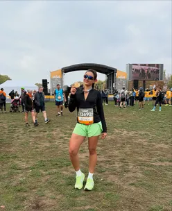 Runner celebrates 2h 7m finish at Royal Parks Half Marathon, with cheers from a friend and post-race brunch at The Table Cafe.