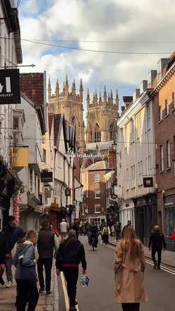 Autumn in York showcasing vibrant foliage, historic architecture, and charming city streets filled with independent shops.