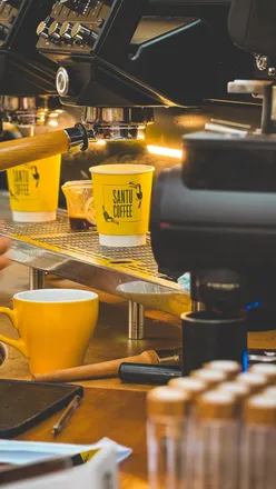 Santu Coffee Roastery in Edinburgh features a minimalistic space with original architectural elements and specialty Brazilian coffee.