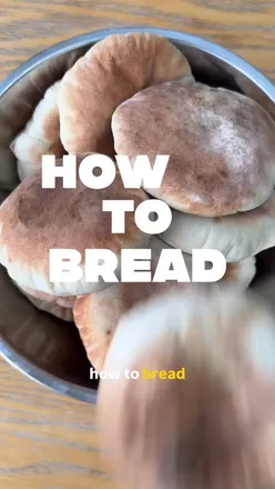 Fluffy homemade pita bread rising in the oven, perfect for taco night or dipping at home.