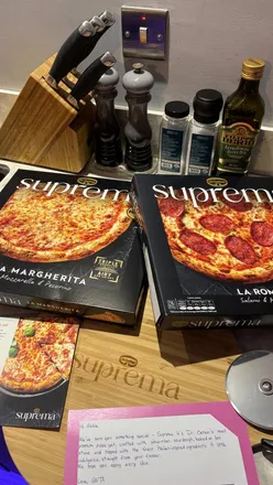 Enjoying Dr. Oetker's La Suprema pizzas with Spianata salami and mozzarella on a cozy night in.