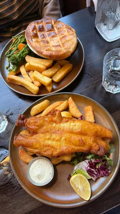 Dining at MHARSANTA in Glasgow, showcasing modern flavors and beautiful presentation in a refined atmosphere.