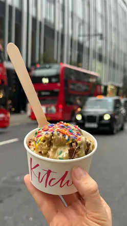 Customers enjoying a build-your-own cookie dough treat at Blondies Kitchen in Selfridges Food Hall, London.