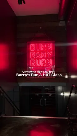 Fitness enthusiasts enjoying a high-energy HIIT session at Barry's UK in London, embracing sweat and strong vibes.