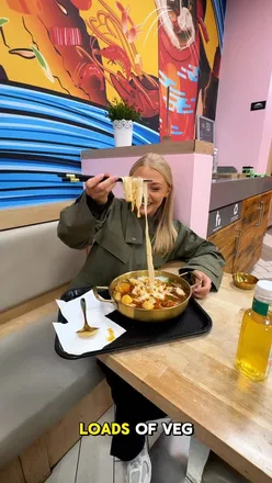 Enjoying a build-your-own malatang hot pot with a variety of fresh ingredients at Soup Co in Manchester.