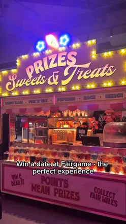 Exciting adults-only fairground arcade featuring games, food vendors, and a chance to win date night tickets!