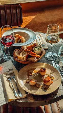 Couple enjoying wine and autumn views at Balfour Winery near London, perfect for a cozy fall outing.
