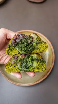 Enjoying Japanese-inspired pastries and coffee art at Nagare Coffee in Bankside, London, including Matcha Daifuku Bun.