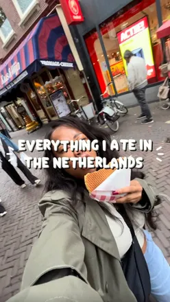 Food lover enjoying diverse dishes like fries, waffles, and dumplings at various Amsterdam eateries.