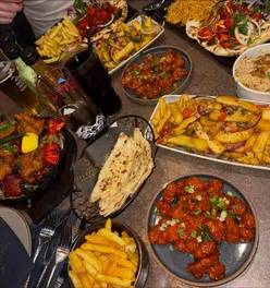 Delicious mixed grill and chicken 65 at Sheepscar Bar & Grill in Leeds, featuring crispy chicken and signature sauces.